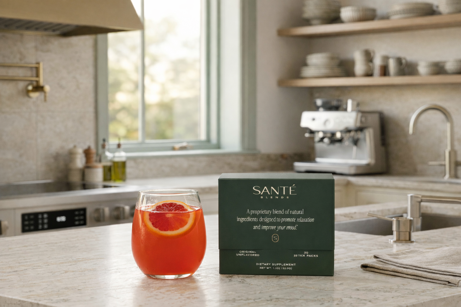 Sante product box with a glass of blood orange beverage on a kitchen counter